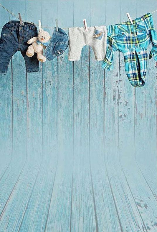 Hanging Clothes Before Blue Wood Wall Backdrop for Photography