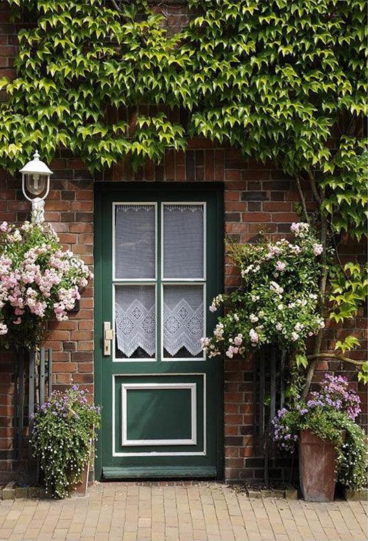 Green Door Surrounded By Green Leaves And Flowers Backdrop For Photography